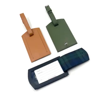 Three luggage tags in Italian leather and blackwatch tartan trim