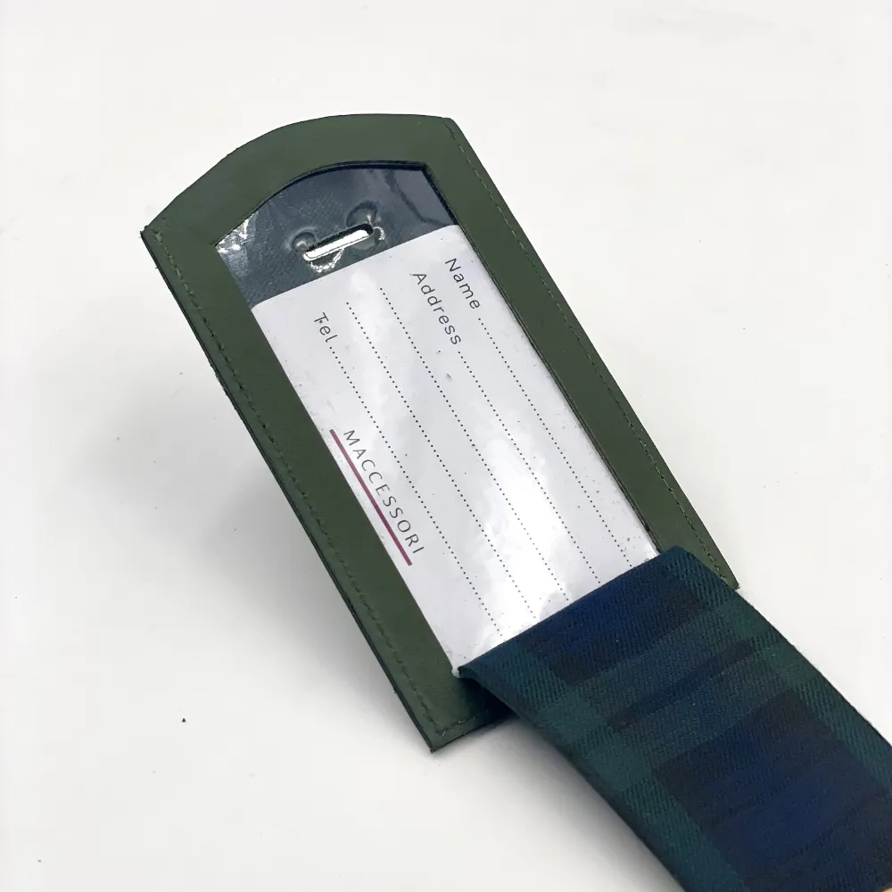 Olive Green leather luggage tag open to show address label and black watch tartan lining